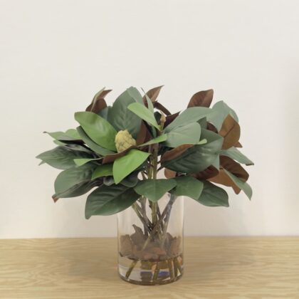 Magnolia leaves araangment in glass vase
